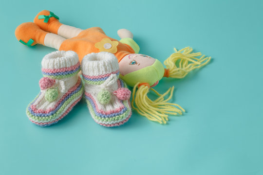 Baby shoes and doll