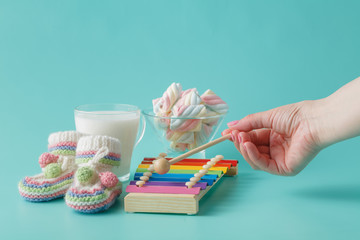 Woman play on kid musical instrument