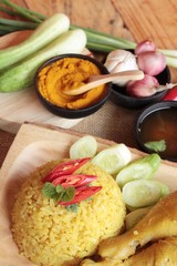 Chicken biryani with rice delicious and sauce.