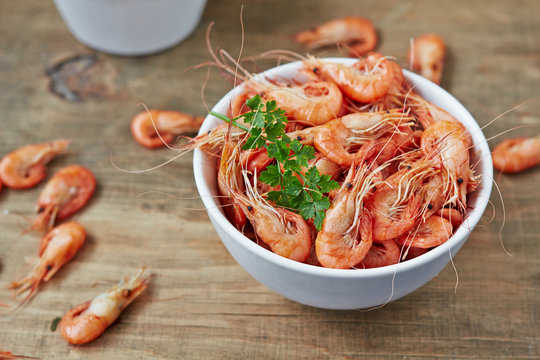 Fresh boiled shrimp on wood background