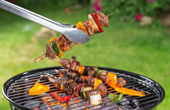Grilled skewers and vegetables, close-up.