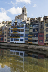 Girona cathedral landmark with houses river reflection