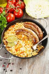 Stewed cabbage with fried sausage