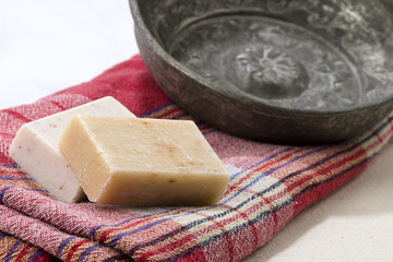 Traditional Turkish bath objects bath bowl, soap and pestemal.