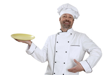 Chef with a yellow bowl in hand and  big smile