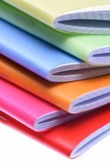 Stack of exercise books isolated on white background