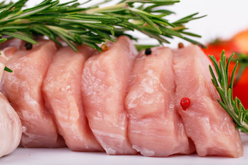 Raw pork steaks on a white background