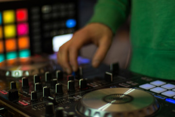 Fototapeta na wymiar Closeup of dj hand on controller with selective focus