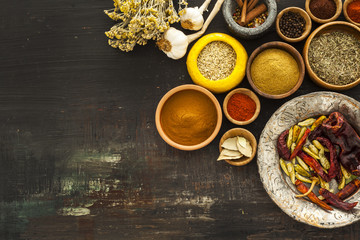 Various spices on vintage board