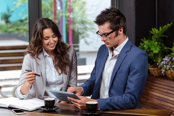 People using tablet and notebook