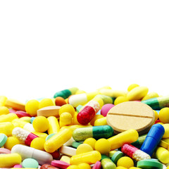 Lot of different medicine pills on a white background