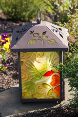 Grablampe mit buntem Glas