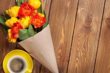 Colorful tulips bouquet and coffee cup