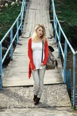 Beautiful hipster girl in white shirt and red cardigan