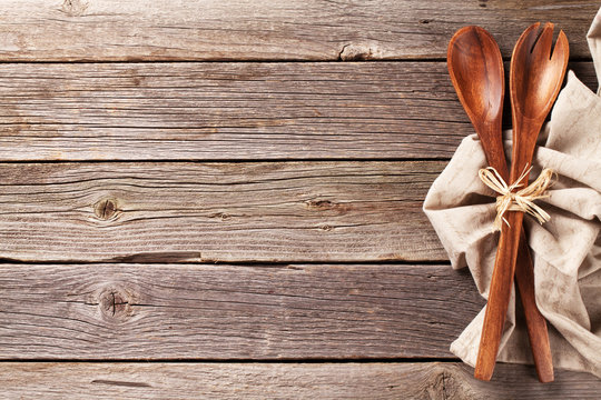 Kitchen utensil over wooden table background