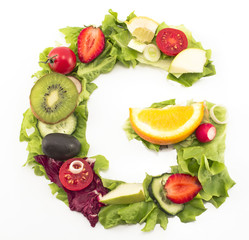 Letter G made of salad and fruits