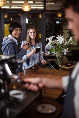 Smiling women having coffee
