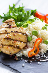 Delicious fried chicken breast and rice with chilli and salad