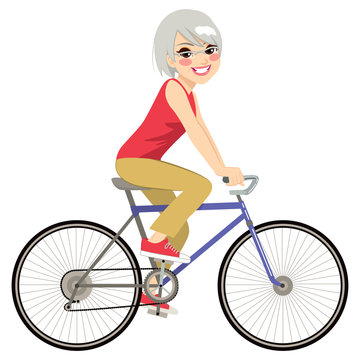 Beautiful senior woman riding bicycle happy side profile view