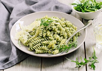 Pasta with pesto ,arugula and parmesan.Selective focus 