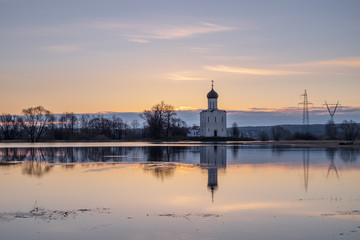 Spring landscape in the early morning with the tide in the vicinity of the temple of the Intercession on the Nerl in Vladimir region in Russia