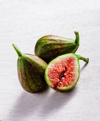 Figs group on rustic white table and white background
