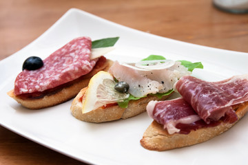 Tasty homemade tapas with different fillings on the table