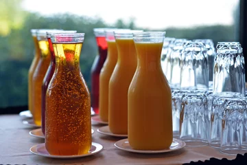 Poster de jardin Jus Carafes of various fruit juice and glasses