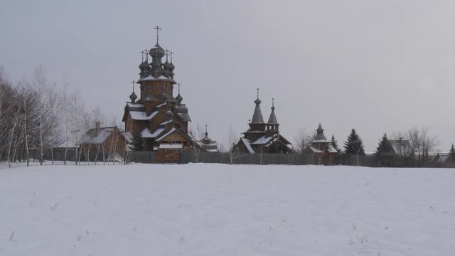 Exterior of Paraskeva the Holy Martyr Church in Pirogovo Ukrainian Sacral Architecture of Baroque Church Made up of Wooden Logs Snow Frosty Day Ukraine