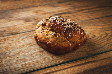 Freshly baked homemade bread on rustic wood background