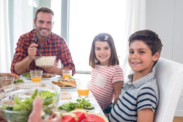 Happy family having breakfast