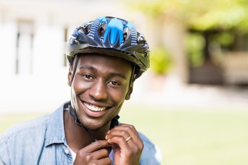 Happy man wearing his helmet