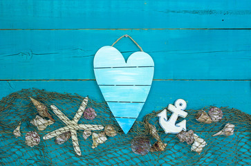 Blank heart sign with seashells and fish net border