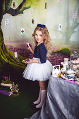 Cute little girl as Alice in Wonderland