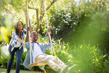 Happy family doing swing