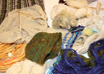 Fototapeta na wymiar Handmade wool works by knitting needles