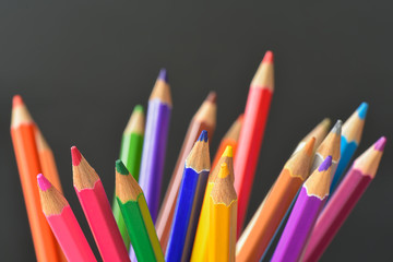 Fototapeta premium Pencil crayons on black background