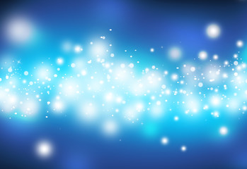 Obraz premium Blue glitter sparkles defocused rays lights bokeh abstract christmas background.