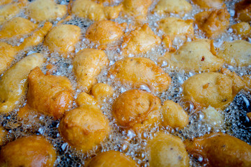 Fried batters in a big pan, the way to make fritters in Ecuador
