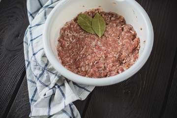 minced meat on wooden table