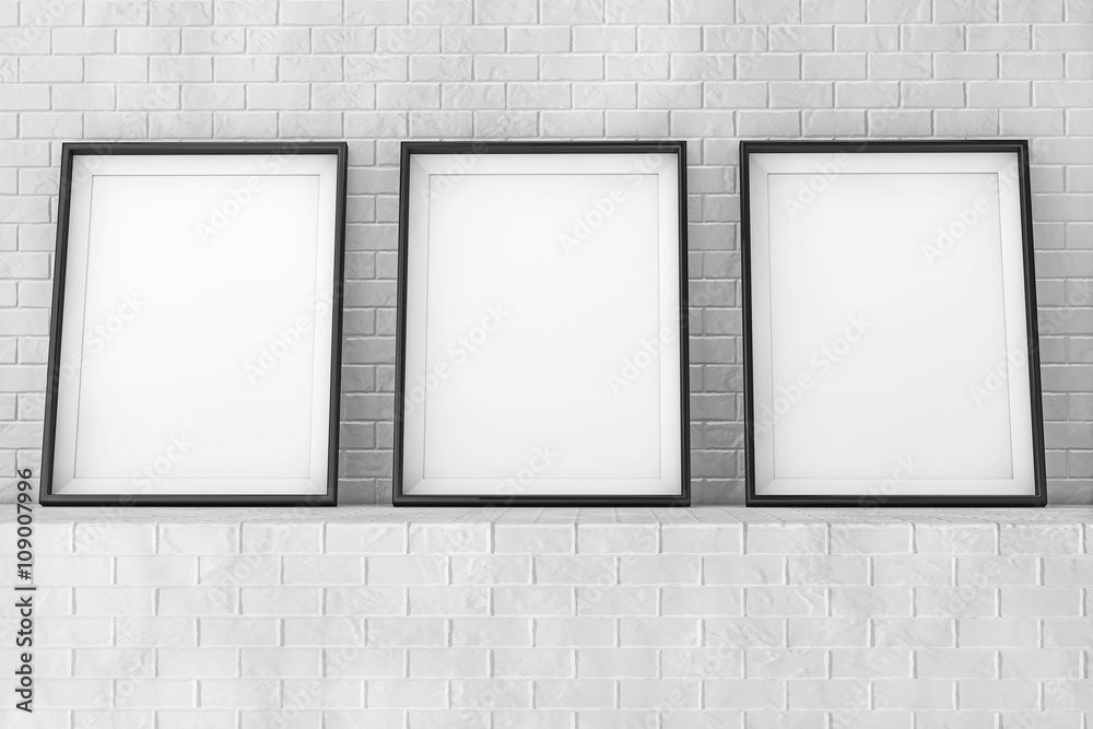Poster blank picture frames on the brick wall. 3d rendering