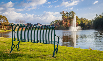 Lake Thinking Bench:
Picture of a neighborhood thinking bench that overlooks a vertical lake fountain in the distance. - Powered by Adobe