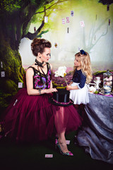 Evil Queen and Alice with white rose