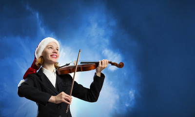 Fototapeta premium Santa woman play violin