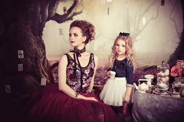 Tea party of Evil Queen and Alice in Wonderland 