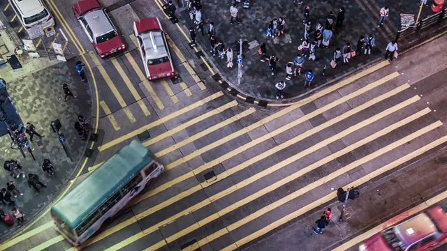 The bird view of the traffic and pedestrians in the downtown of Hong Kong,China 
