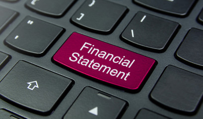Business Concept: Close-up the Financial Statement button on the keyboard and have Magenta color button isolate black keyboard