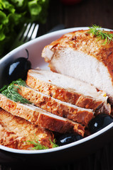 meat baked with olive on the wooden table