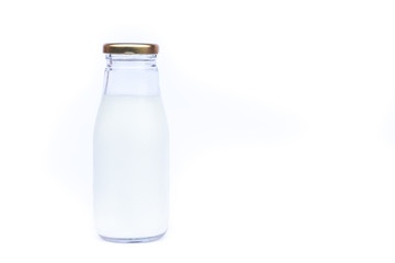 Traditional glass milk bottle on white background