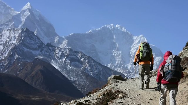 Trekkers hiking at High Himalaya mountain